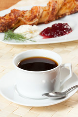 Light meal with coffee, bread and jam.