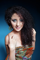 Fototapeta premium Beautiful young woman with curly hair