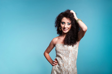 Beautiful young woman with curly hair