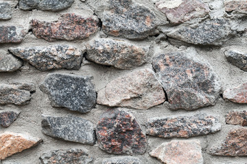 Old gray rough stone wall background photo texture