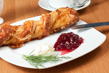 Light meal with coffee, bread and jam.