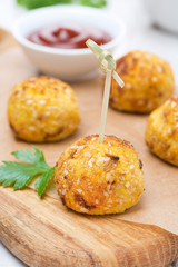 chicken meatballs in corn breading with tomato sauce