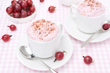 delicious mousse with whipped cream and gooseberries