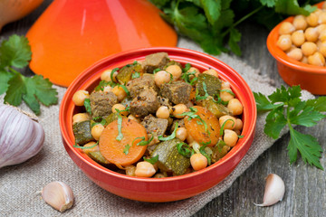 tagine with beef, chickpeas, vegetables and herbs, top view