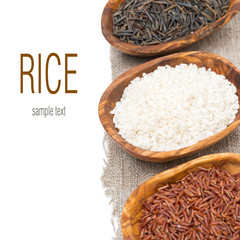 three varieties of rice in wooden bowls, isolated