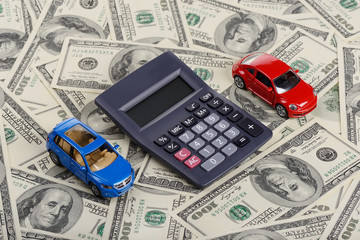 Car toys and calculator among the dollars