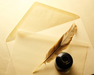 Envelope with inkwell and feather