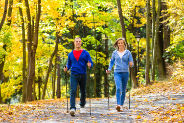 Nordic walking - active people working out outdoor