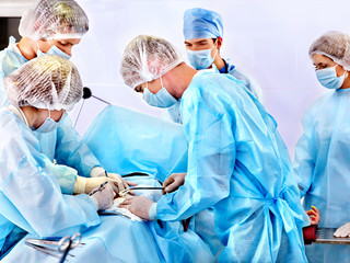 Surgeon at work in operating room.
