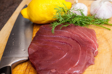 Raw tuna steaks on a cutting board 