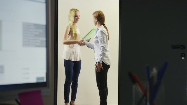 team of business women working in office at night