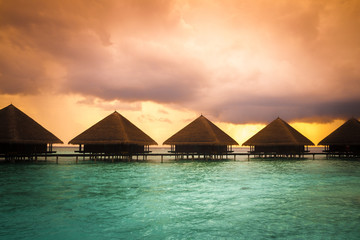 Over water bungalows with steps into amazing green lagoon