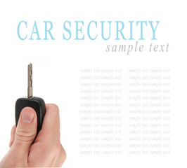 Hand holding car keys isolated on white background