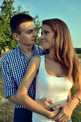 Beautiful young couple posing at the camera