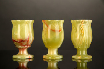 Onyx cups on grey background
