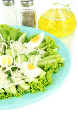 Delicious salad with eggs, cabbage and cucumbers, isolated