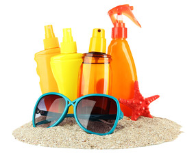 Bottles with suntan cream and sunglasses, isolated on white