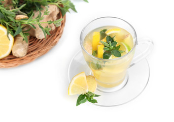 Cup of tea with ginger isolated on white