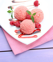 Delicious ice cream on plate on table close-up