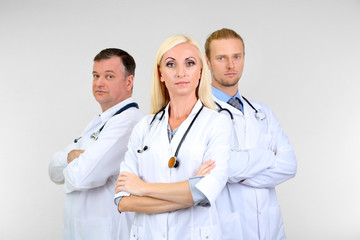 Medical workers on grey background