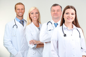 Fototapeta premium Medical workers on grey background