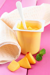 Tasty yogurt with pieces of fresh fruit,