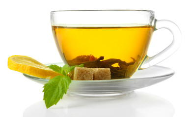 Transparent cup of green tea with lemon and mint isolated