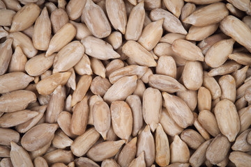 Top view of peeled sunflower seeds - background