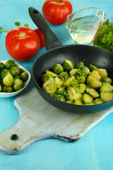 Fresh brussels sprouts in pan with vegetables and spices