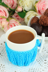Cup with knitted thing on it close up