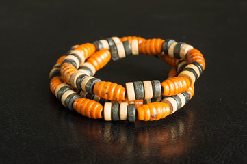 Wooden necklace on a black background