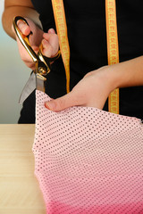 Cutting fabric with tailors scissors