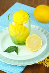 Delicious ice cream in glass on table close-up