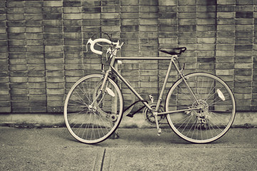 Fototapeta na wymiar Vintage bicycle parked on the street