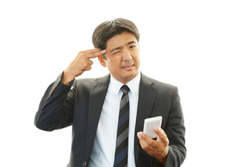 困惑するビジネスマン
