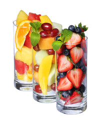 Fruit cocktails isolated. Fresh pieces of fruit in glasses