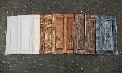 nine different colored doors lying close to each other