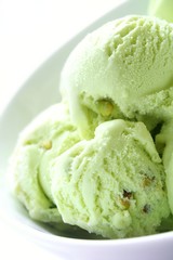 Pistachio ice cream in white bowl