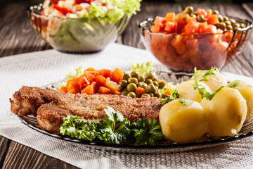 Breaded cutlet and potatoes