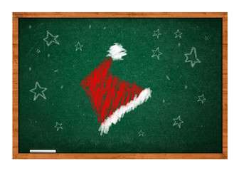 Santa Claus hat on green chalkboard