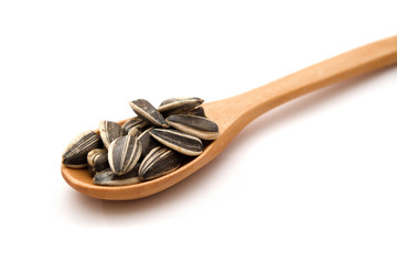Sunflower seeds on wood spoon