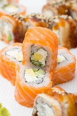 Philadelphia and canada roll on white plate with wasabi
