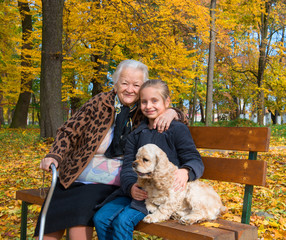 Grandmother and child sitting on the bench