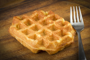 freshly baked waffles close up on the wood