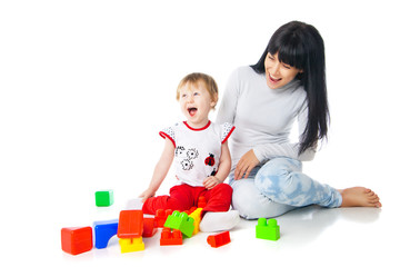 Obraz na płótnie Canvas mother and baby playing with building blocks toy