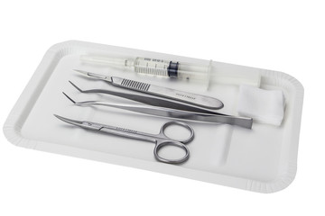 some medical - dental  instruments on the tray