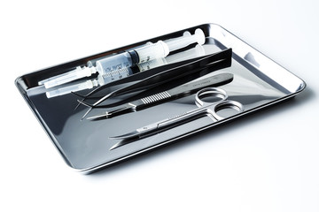 some medical - dental  instruments on the tray
