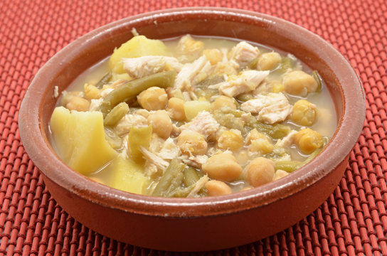 clay dish of stewed chickpeas with meat, beans and potatoes
