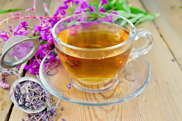 Herbal tea from fireweed in a glass cup with strainer