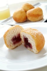 sugared donuts on white plate